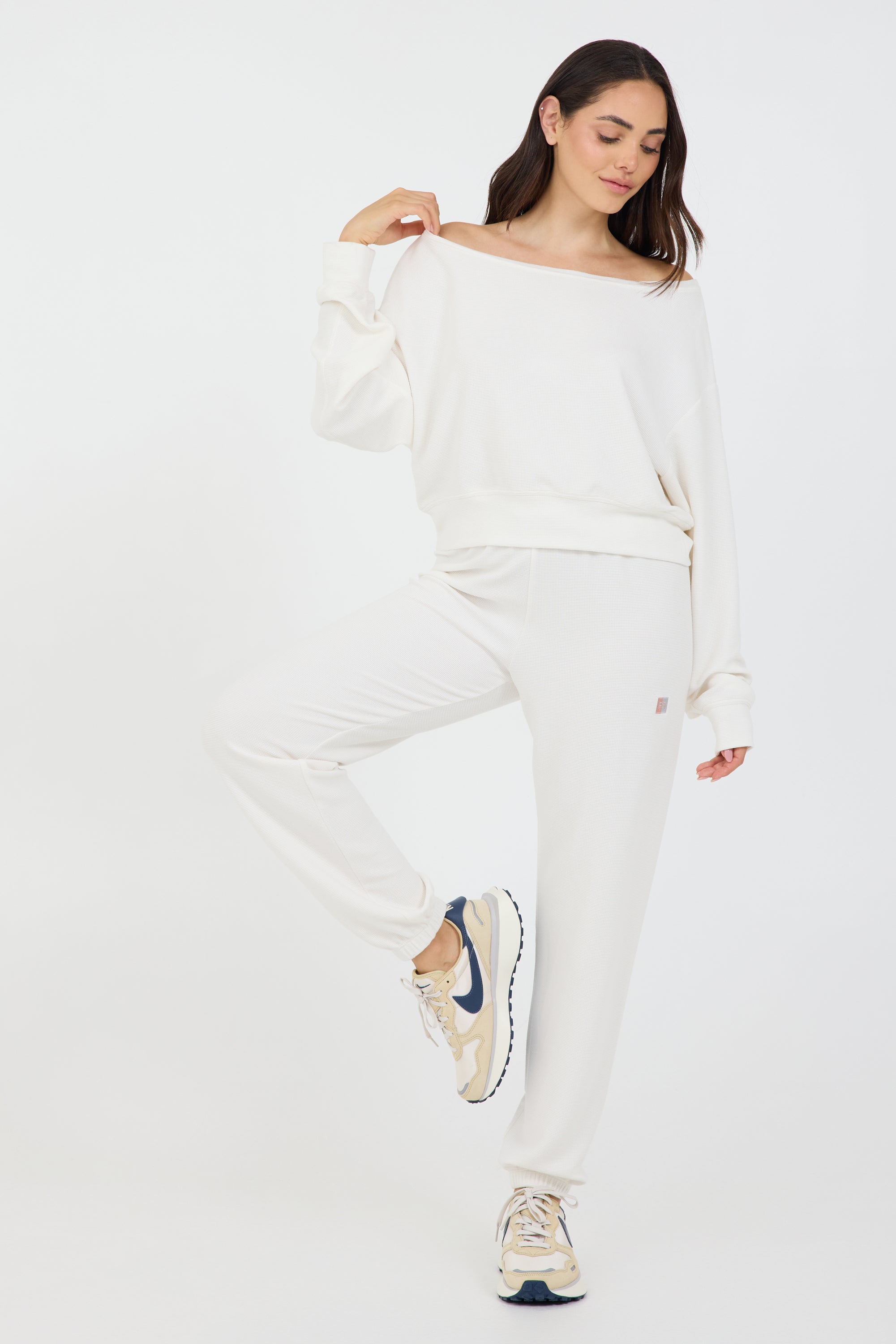 Amiee Off the Shoulder Long Sleeve in coconut cream, modeled with the Delaney joggers from the front