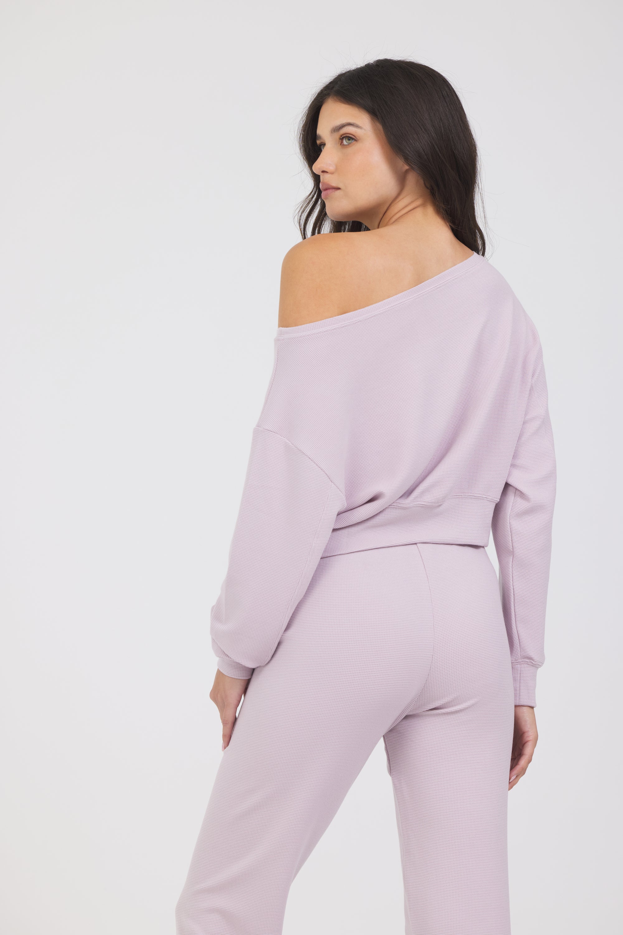 Amiee Off the Shoulder Long Sleeve in dusty pink, modeled with the Delaney joggers from the back
