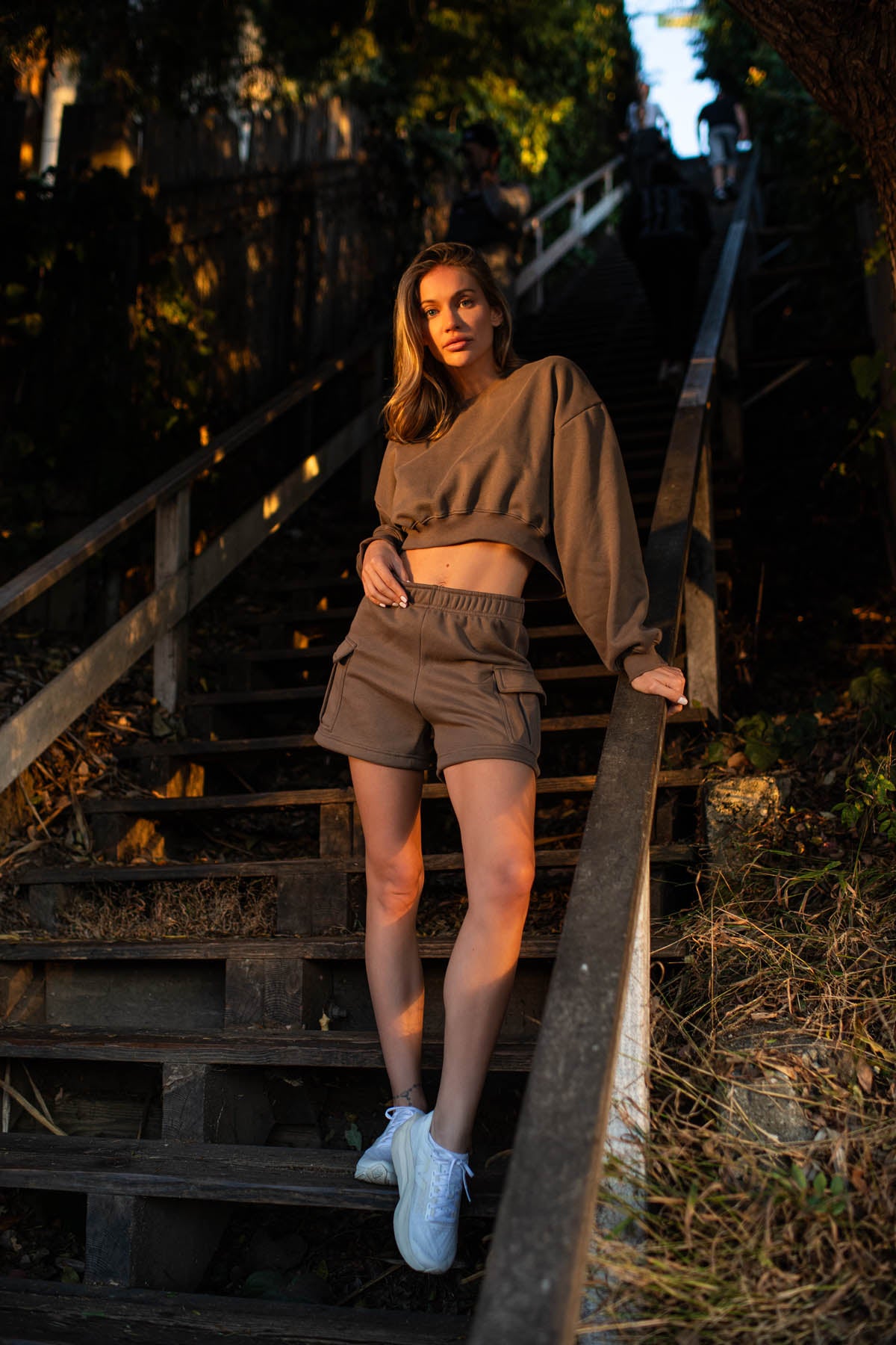 Claire fleece cropped long sleeve in dark truffle, modeled with the Sam fleece cargo shorts from the front