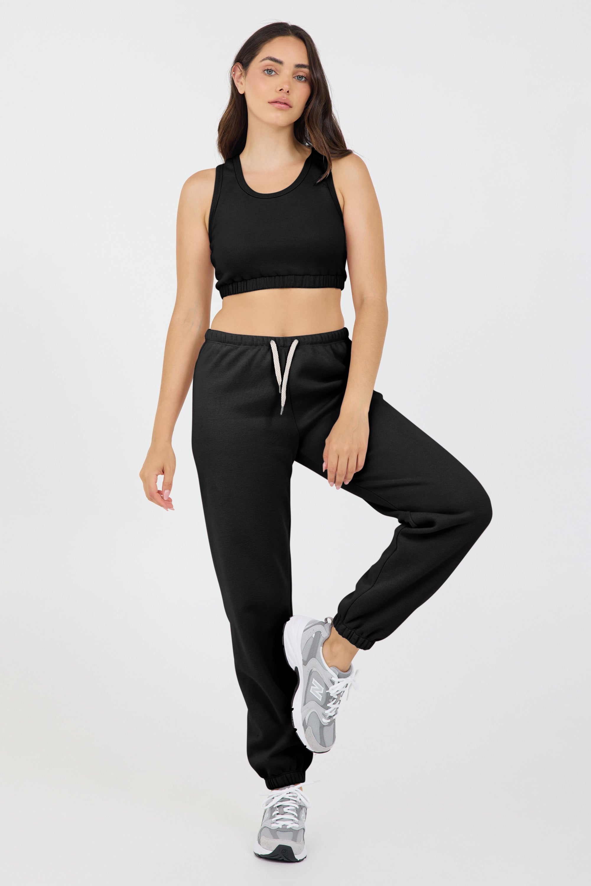 the Fleece elasticized waist tank top in black, modeled with the Lori Fleece joggers from the front