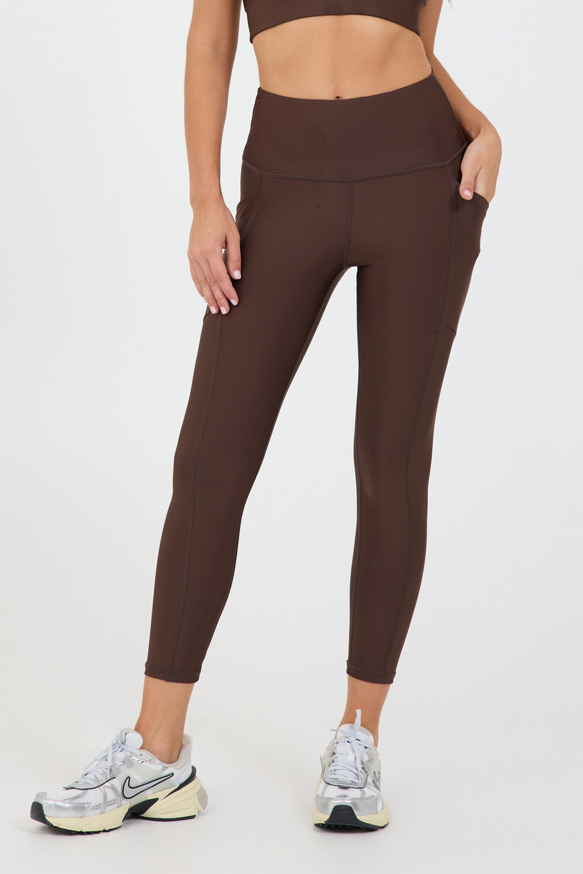 Joey 2 pocket 7/8 Legging in dark truffle, modeled with the Joey bra from the front close up