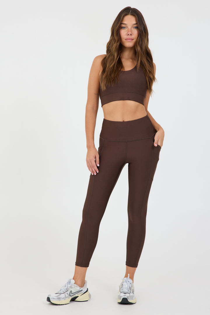 Joey 2 pocket 7/8 Legging in dark truffle, modeled with the Joey bra from the front