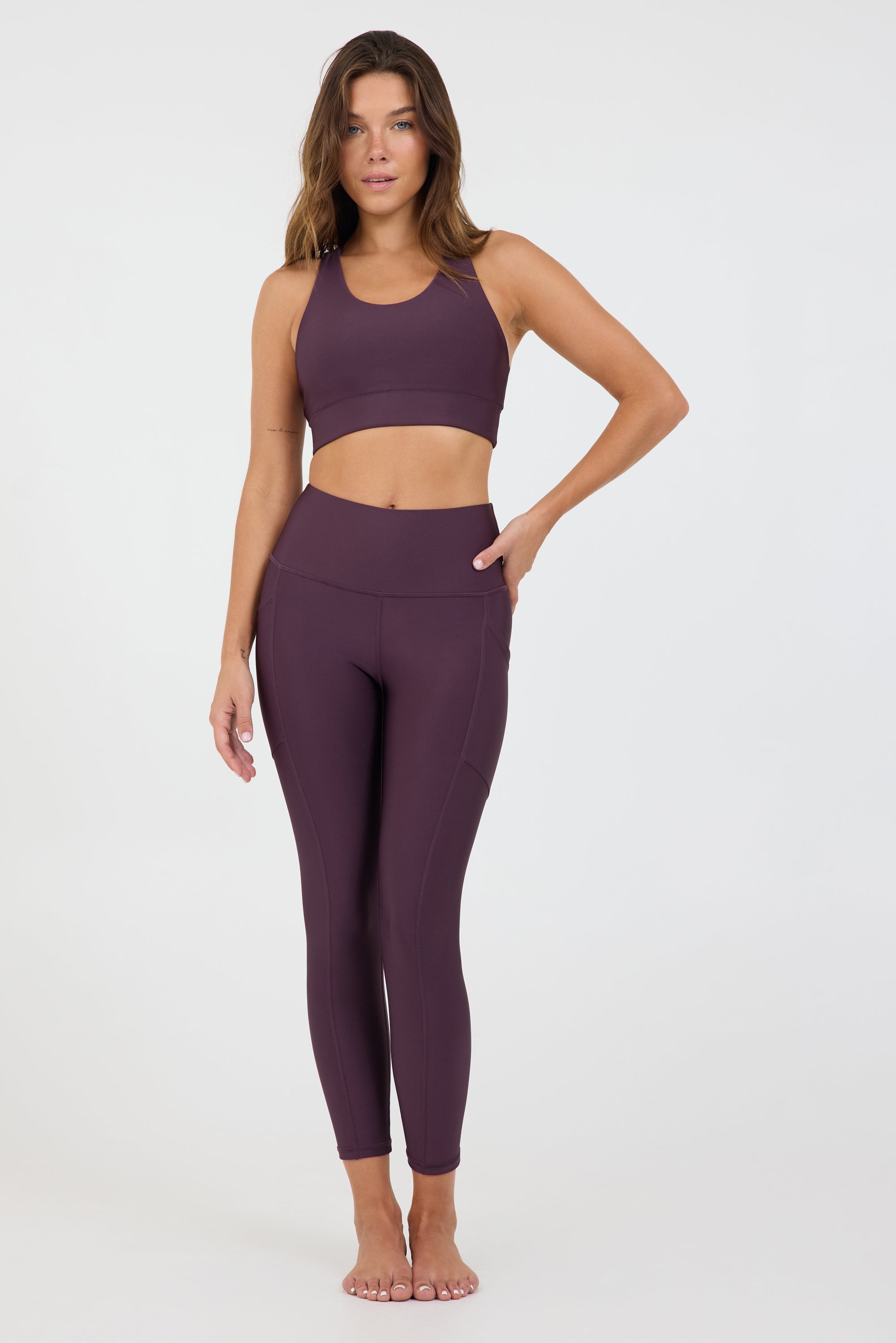 Joey bra in dark haze, modeled with the Robby 7/8 leggings from the front