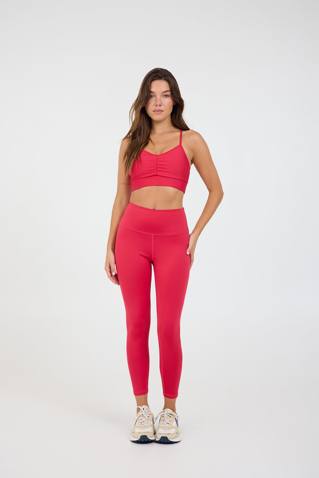 Kenzie 7/8 Leggings in viva-magenta, modeled with the Julian Ruched front strap bra from the front