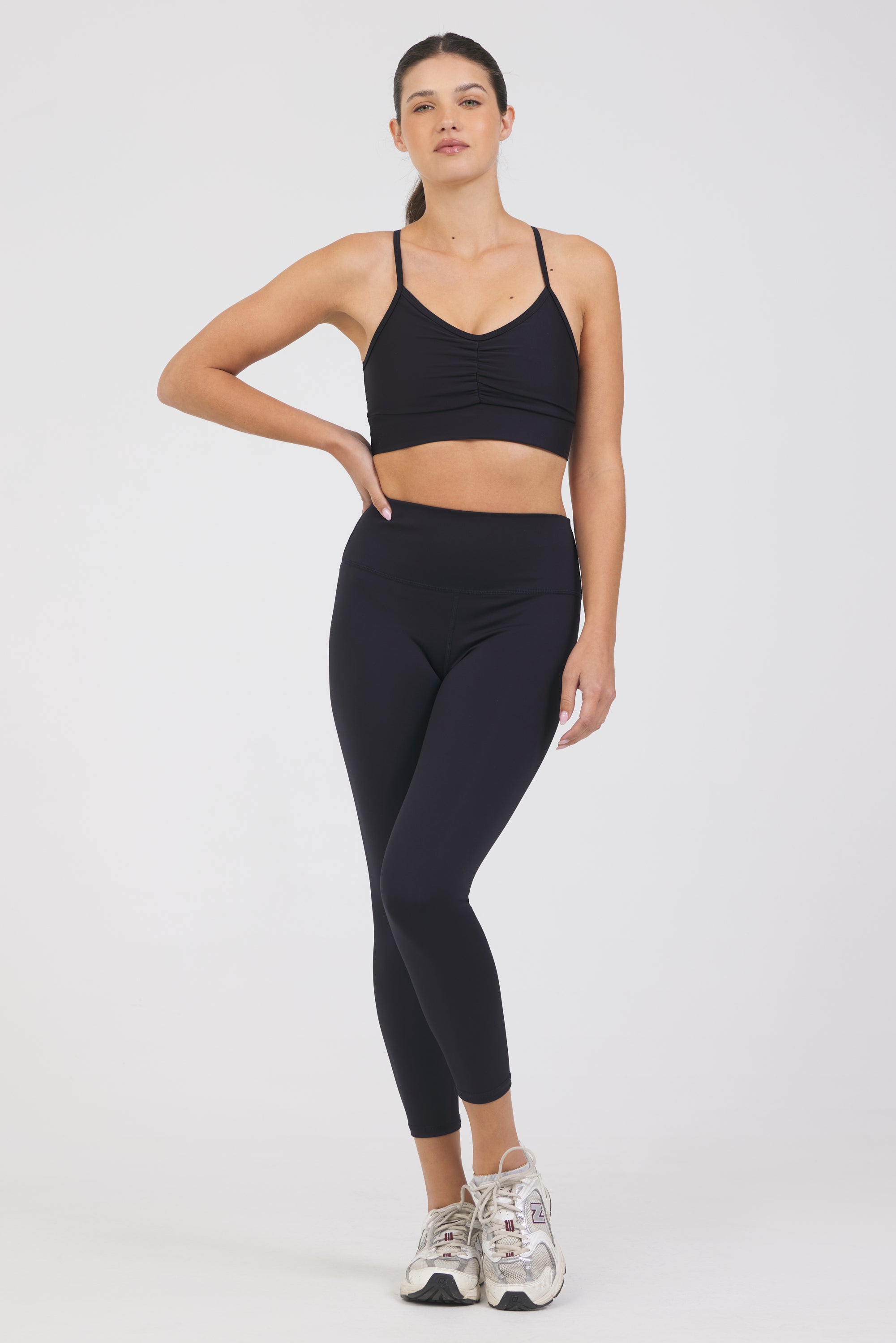 Kenzie 7/8 Leggings in black, modeled with the Karlee Ruched front strap bra from the front