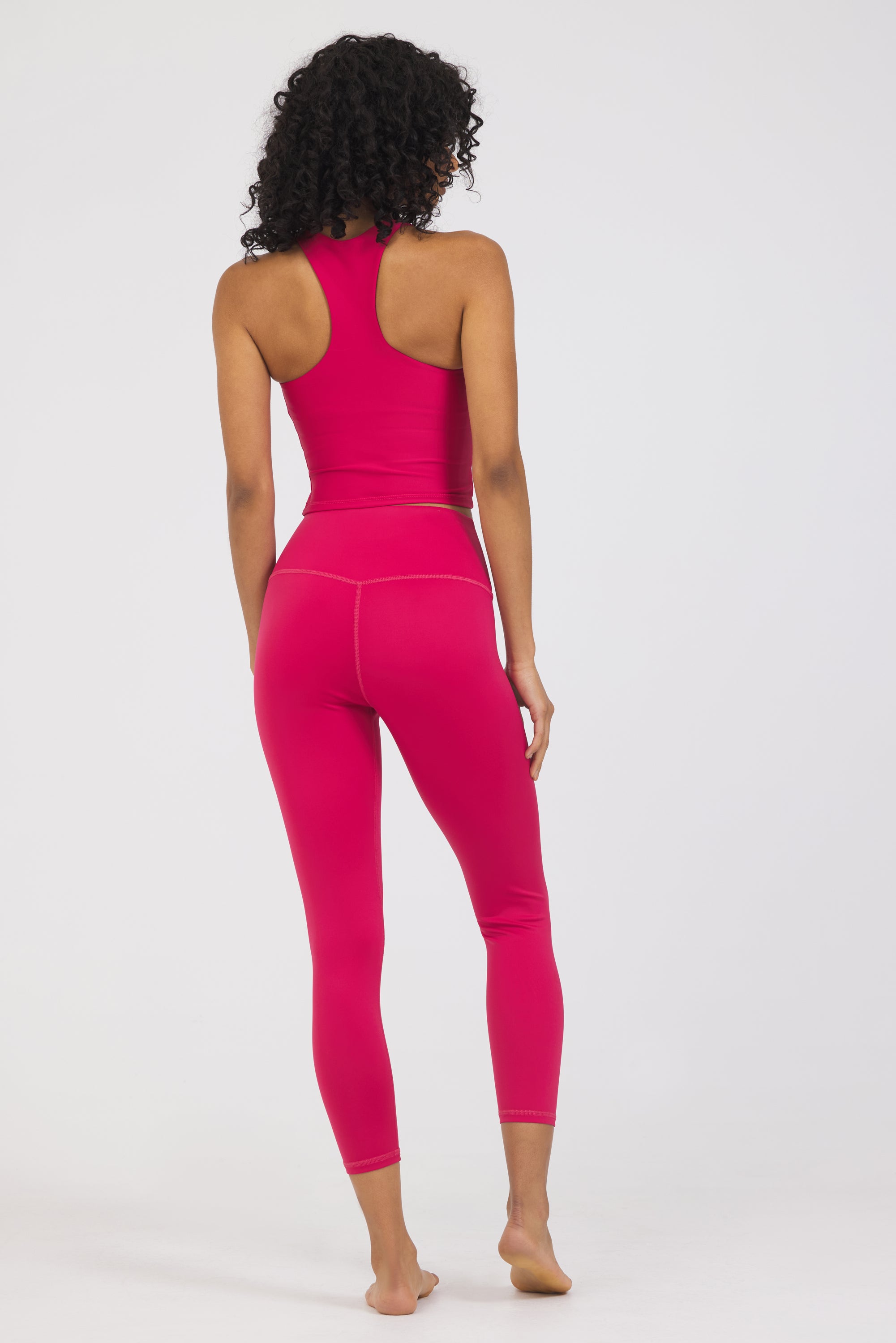 Kenzie 7/8 Leggings in viva-magenta, modeled with the Sweetheart Neckline bra from the back