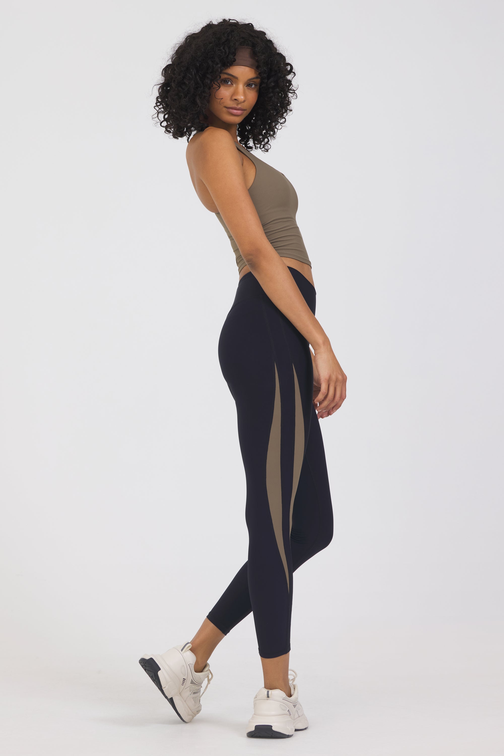 Krista side panel 7/8 leggings in black and truffle, from the side