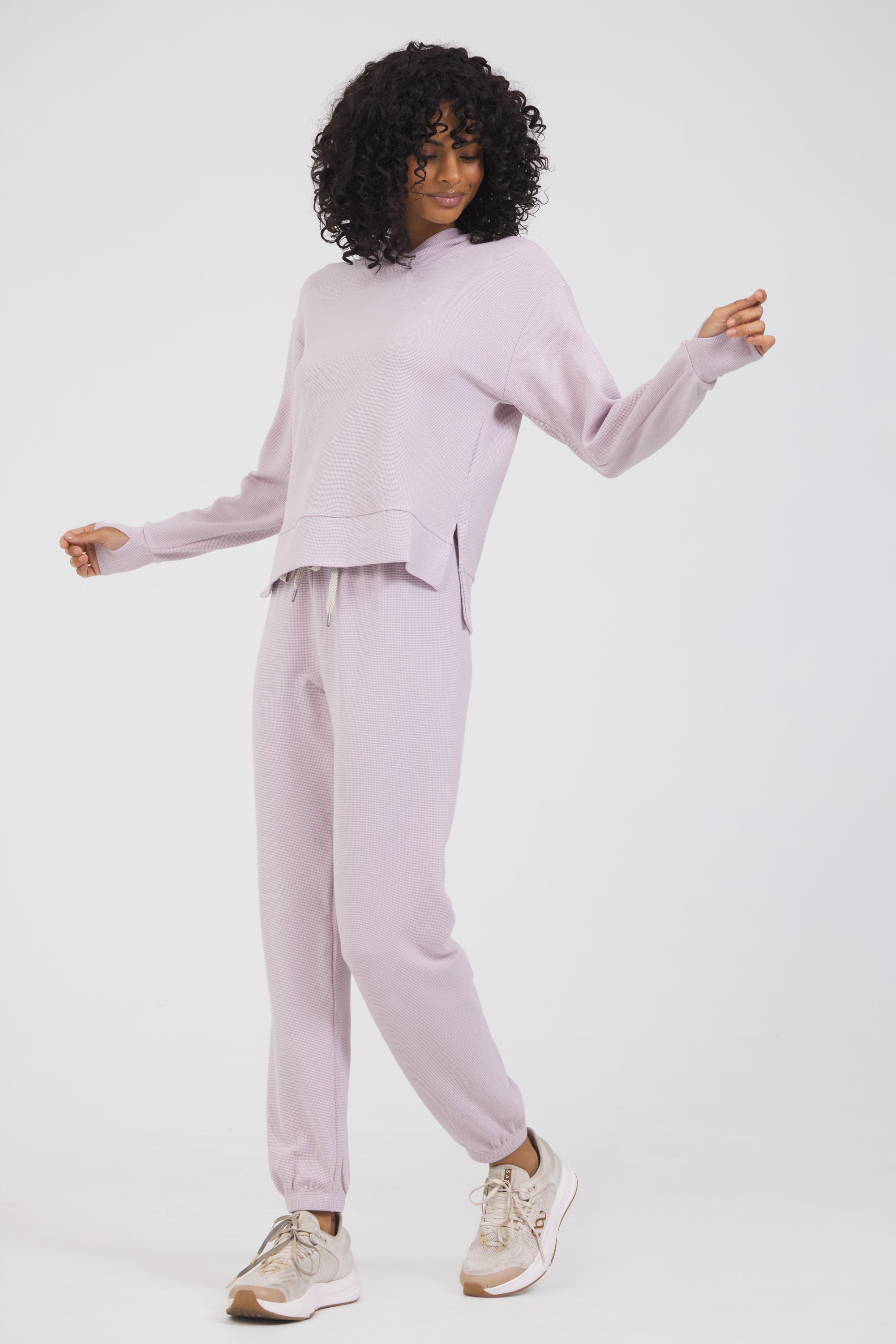 Lynn pullover hoodie with long sleeves in dusty pink, modeled with the Delaney joggers from the front