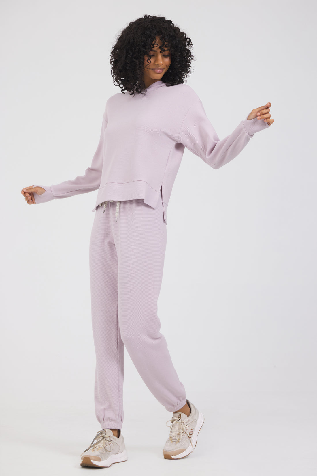 Lynn pullover hoodie with long sleeves in dusty pink, modeled with the Delaney joggers from the front