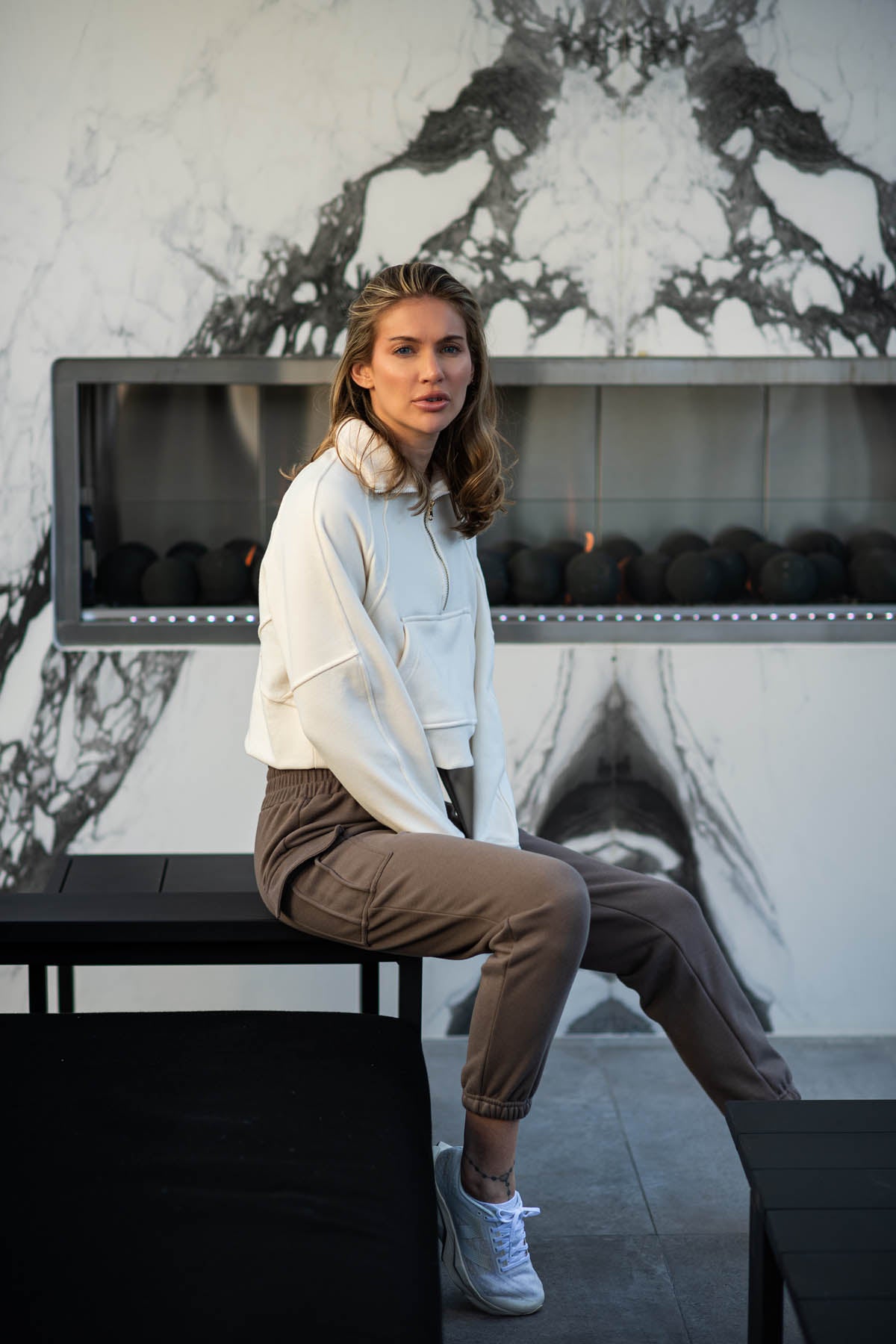 Morgan Fleece half zip long sleeve in bone, modeled with the Lori Fleece joggers sitting down