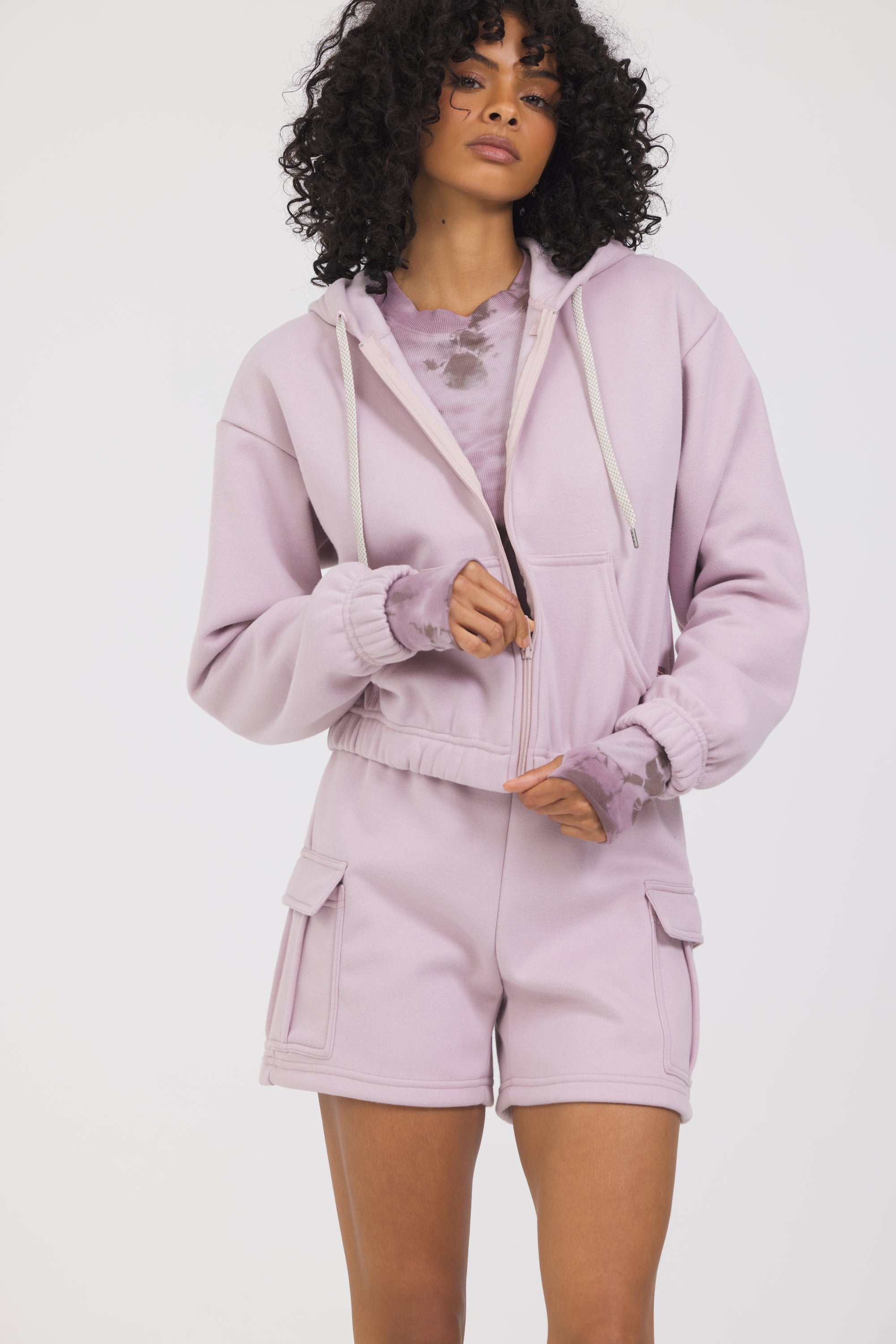 Nicole Fleece zipped cropped hoodie in dusty pink, modeled with the Sam fleece cargo shorts from the front