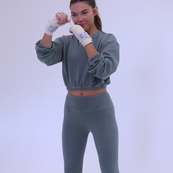 Long sleeve rib crop top with an elasticized waist in teal display video