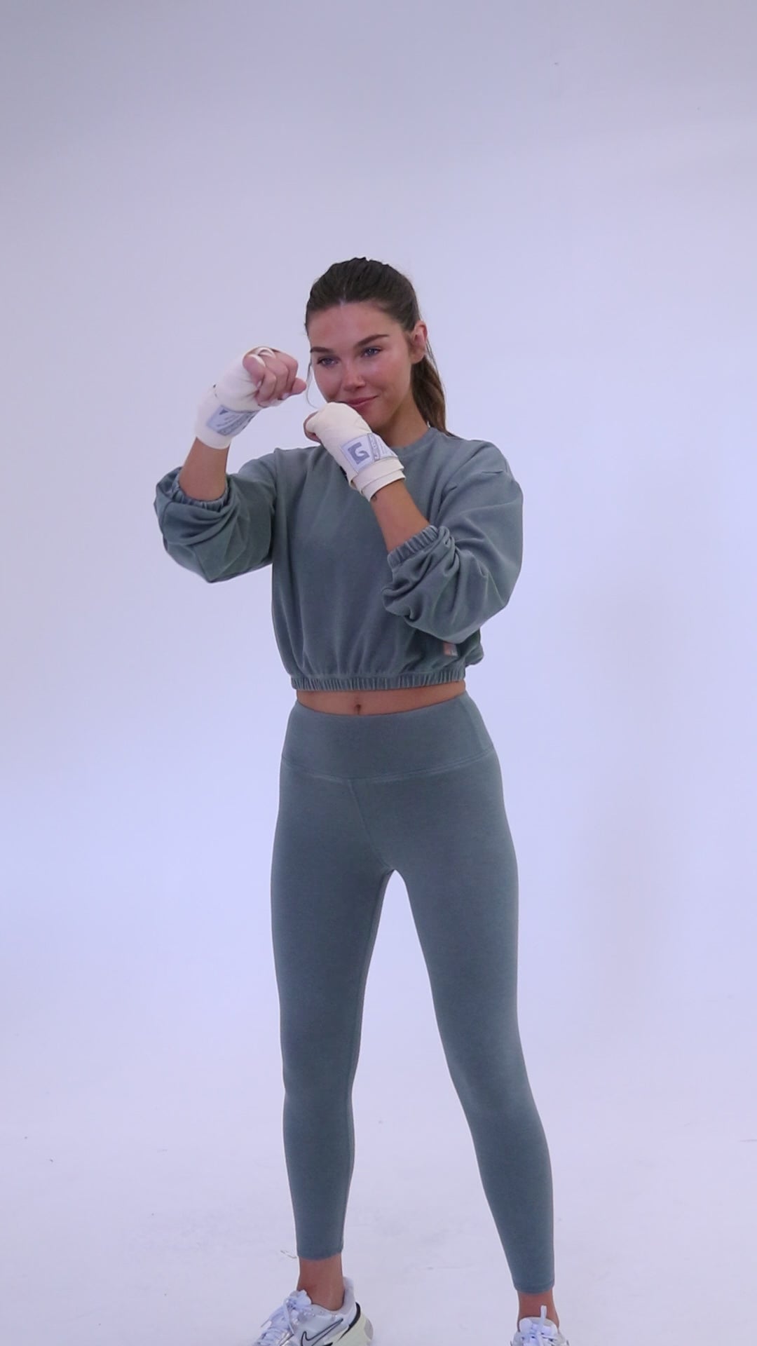Long sleeve rib crop top with an elasticized waist in teal display video