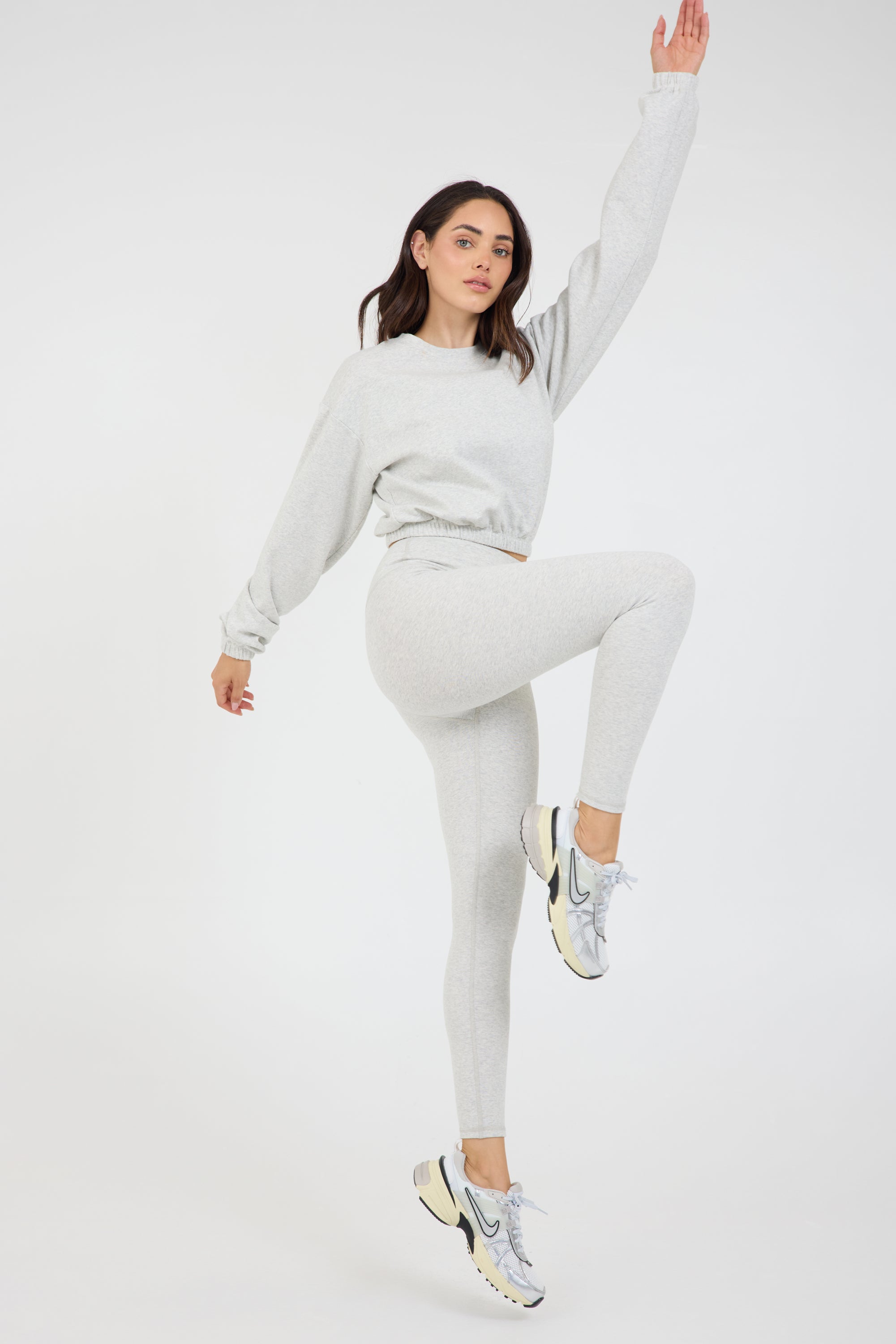 Long sleeve rib crop top with an elasticized waist in athletic grey, from the side