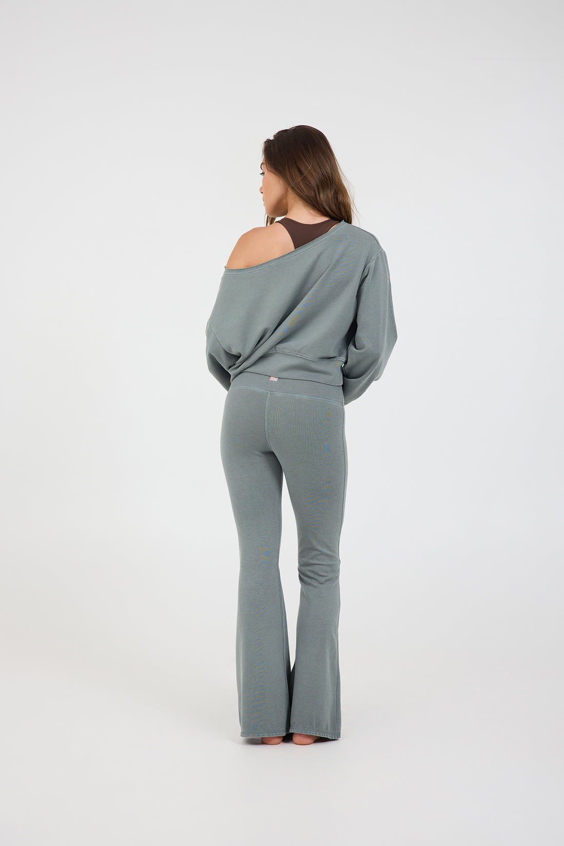 Rib off the shoulder long sleeve in teal, from the back
