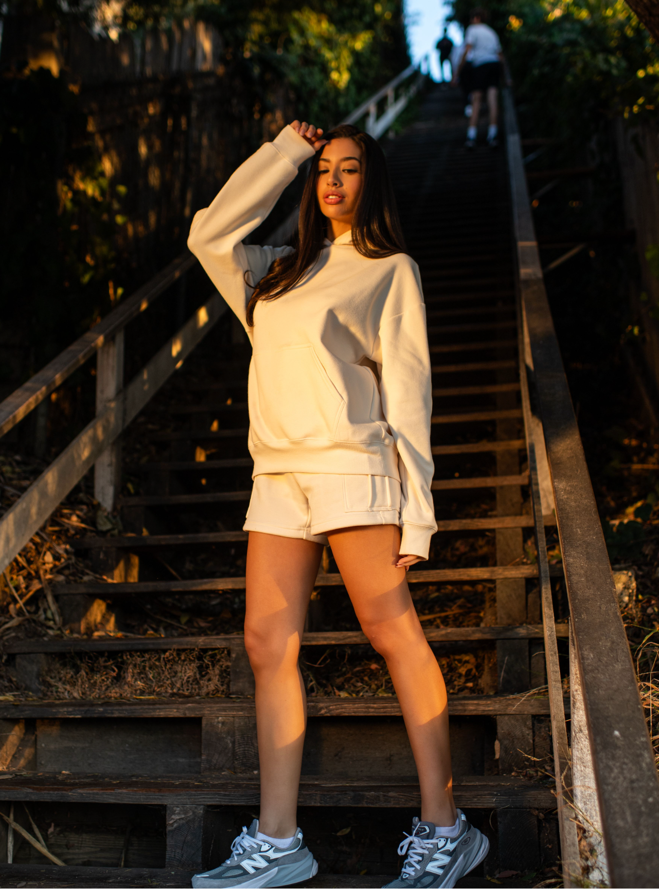 Sam fleece cargo shorts in bone, modeled from the front