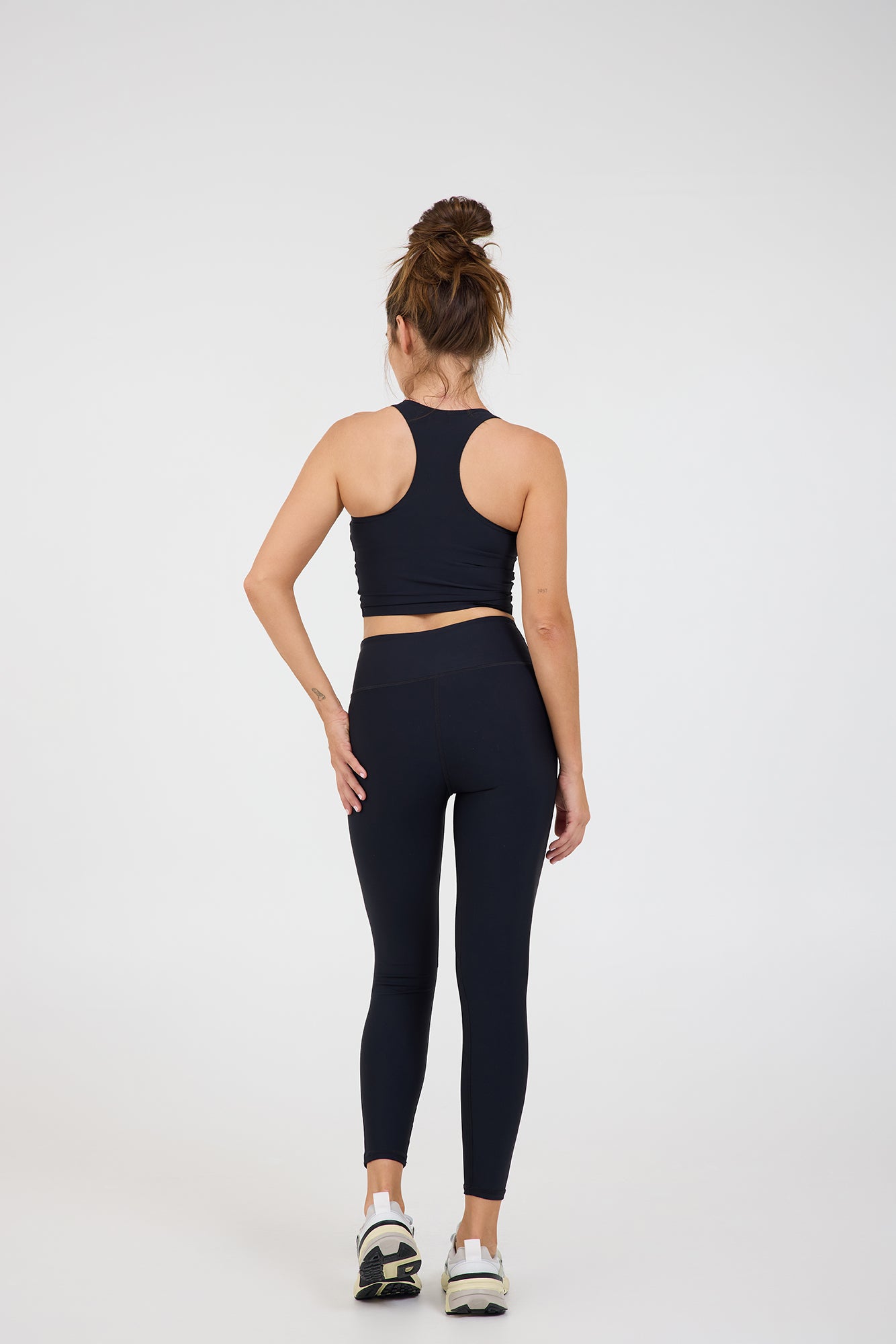 Sweetheart Neckline bra in black, modeled with the Kenzie  7/8 leggings from the back
