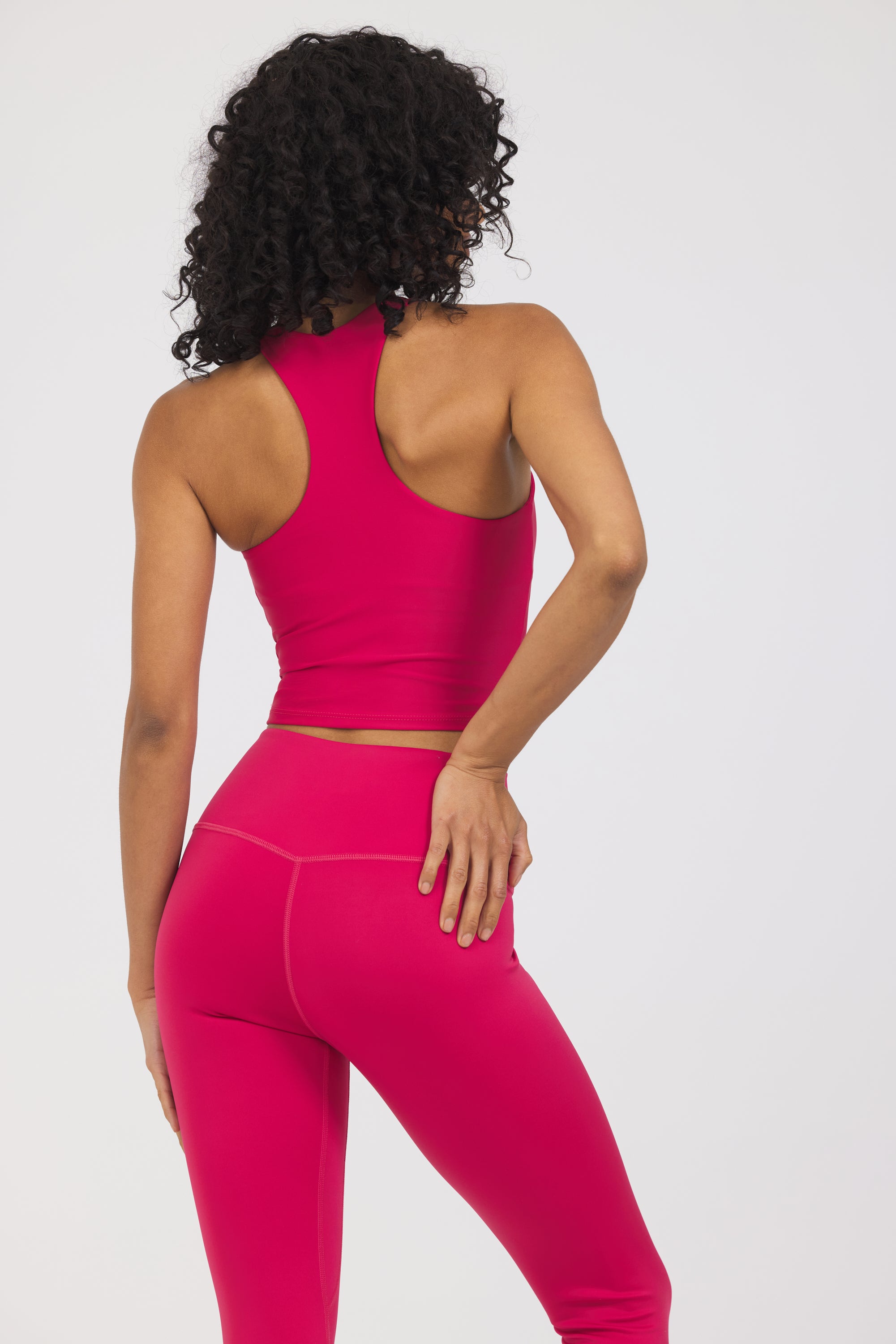 Sweetheart Neckline bra in viva magenta, modeled with the Kenzie  7/8 leggings from the back