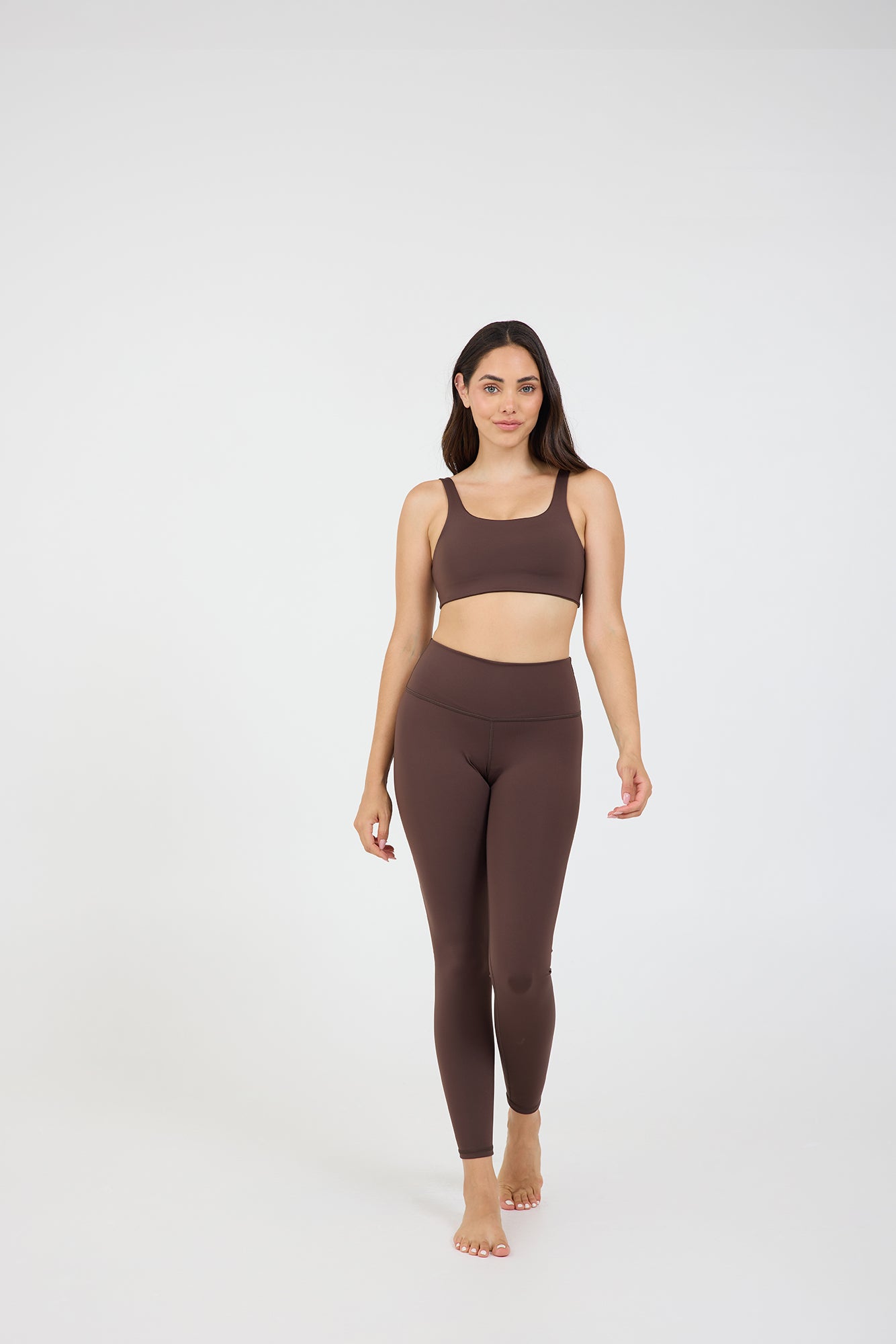 Taylor bra in dark fudge, modeled with the Taylor 7/8 leggings from the front